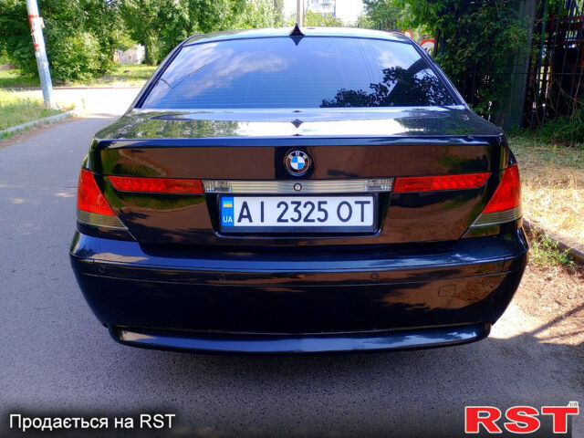 Черный БМВ 7 Серия, объемом двигателя 4.4 л и пробегом 380 тыс. км за 7600 $, фото 2 на Automoto.ua