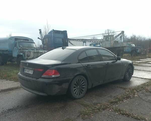Черный БМВ 7 Серия, объемом двигателя 3 л и пробегом 420 тыс. км за 7000 $, фото 3 на Automoto.ua