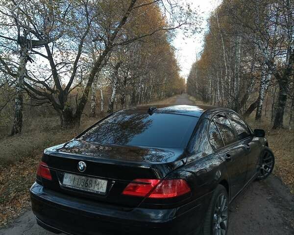 Черный БМВ 7 Серия, объемом двигателя 4.4 л и пробегом 282 тыс. км за 8000 $, фото 1 на Automoto.ua