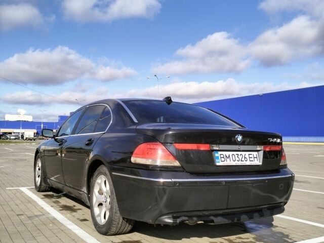 Черный БМВ 7 Серия, объемом двигателя 4.4 л и пробегом 240 тыс. км за 7000 $, фото 2 на Automoto.ua