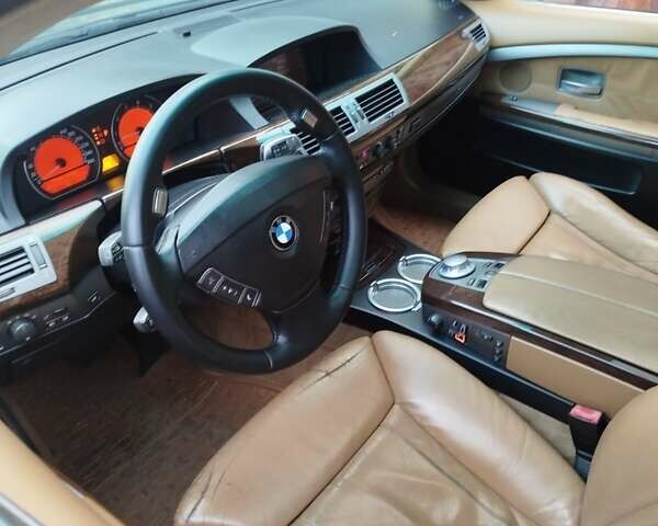 Черный БМВ 7 Серия, объемом двигателя 4.4 л и пробегом 407 тыс. км за 5600 $, фото 1 на Automoto.ua