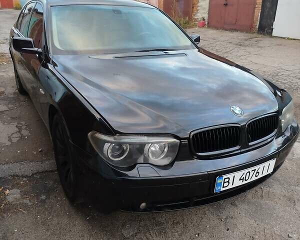 Черный БМВ 7 Серия, объемом двигателя 4.4 л и пробегом 407 тыс. км за 5600 $, фото 3 на Automoto.ua
