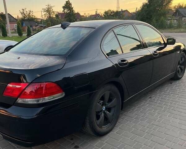 Черный БМВ 7 Серия, объемом двигателя 4.8 л и пробегом 310 тыс. км за 11550 $, фото 2 на Automoto.ua