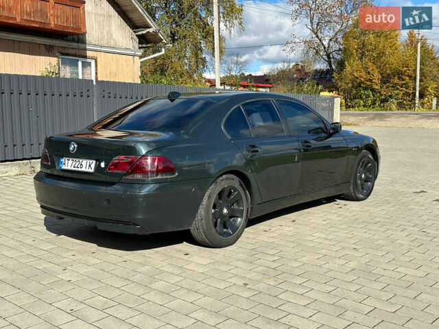 Черный БМВ 7 Серия, объемом двигателя 4 л и пробегом 403 тыс. км за 8500 $, фото 1 на Automoto.ua