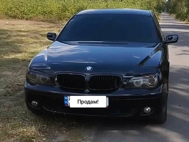 Черный БМВ 7 Серия, объемом двигателя 4 л и пробегом 268 тыс. км за 8500 $, фото 1 на Automoto.ua
