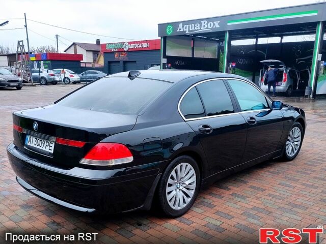 Черный БМВ 730, объемом двигателя 3 л и пробегом 430 тыс. км за 7000 $, фото 2 на Automoto.ua