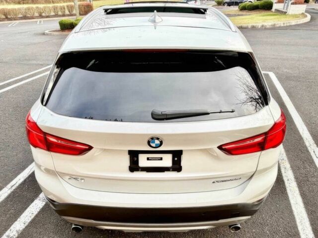 Белый БМВ Х1, объемом двигателя 2 л и пробегом 49 тыс. км за 10000 $, фото 4 на Automoto.ua