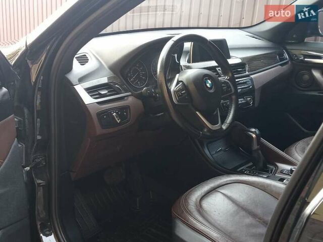 Чорний БМВ Х1, об'ємом двигуна 2 л та пробігом 125 тис. км за 13999 $, фото 1 на Automoto.ua