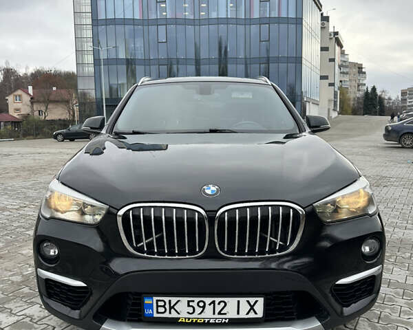 Черный БМВ Х1, объемом двигателя 2 л и пробегом 115 тыс. км за 17850 $, фото 1 на Automoto.ua