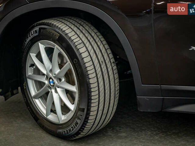 Коричневый БМВ Х1, объемом двигателя 2 л и пробегом 129 тыс. км за 23685 $, фото 7 на Automoto.ua
