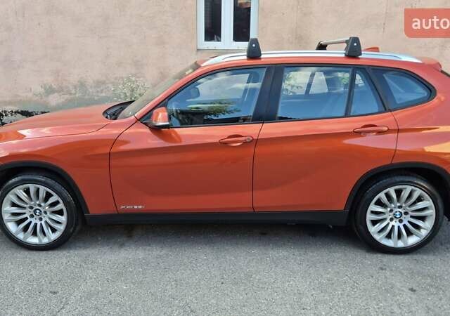 Красный БМВ Х1, объемом двигателя 2 л и пробегом 200 тыс. км за 12000 $, фото 1 на Automoto.ua