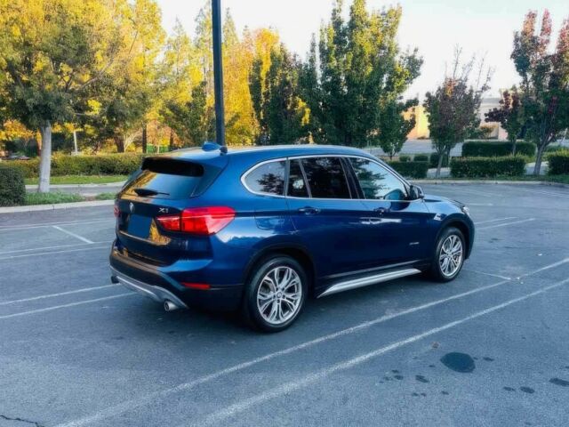 Синий БМВ Х1, объемом двигателя 2 л и пробегом 73 тыс. км за 12600 $, фото 3 на Automoto.ua