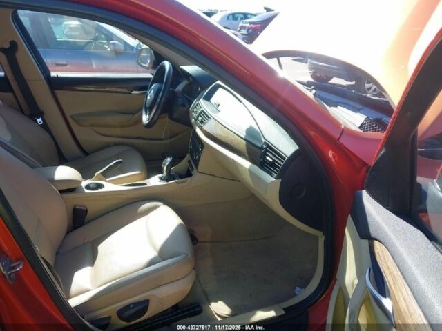 Оранжевый БМВ Х1, объемом двигателя 2 л и пробегом 140 тыс. км за 8500 $, фото 3 на Automoto.ua