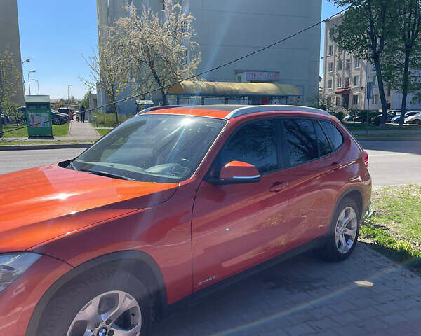 Оранжевый БМВ Х1, объемом двигателя 2 л и пробегом 126 тыс. км за 13300 $, фото 1 на Automoto.ua