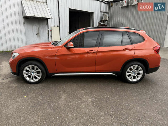 Помаранчевий БМВ Х1, об'ємом двигуна 2 л та пробігом 163 тис. км за 10400 $, фото 1 на Automoto.ua