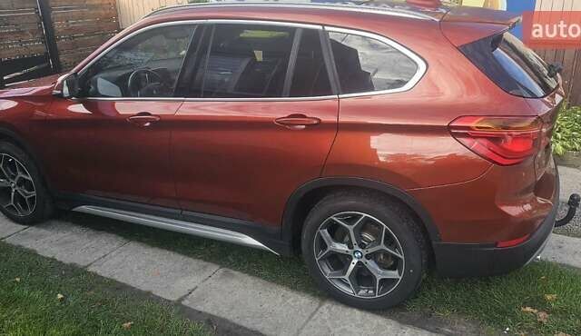 Оранжевый БМВ Х1, объемом двигателя 2 л и пробегом 65 тыс. км за 21600 $, фото 3 на Automoto.ua