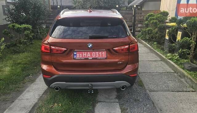 Оранжевый БМВ Х1, объемом двигателя 2 л и пробегом 65 тыс. км за 21600 $, фото 4 на Automoto.ua