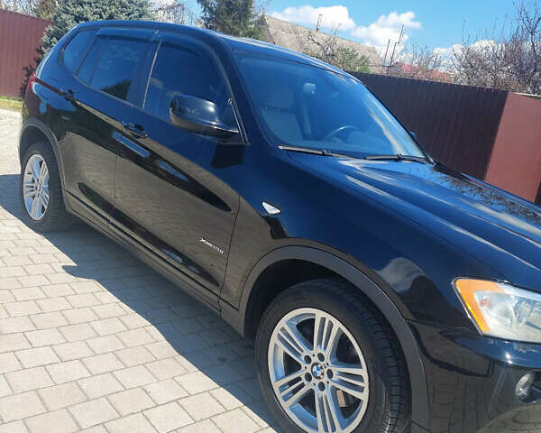 Синій БМВ Х3, об'ємом двигуна 2 л та пробігом 65 тис. км за 16599 $, фото 5 на Automoto.ua