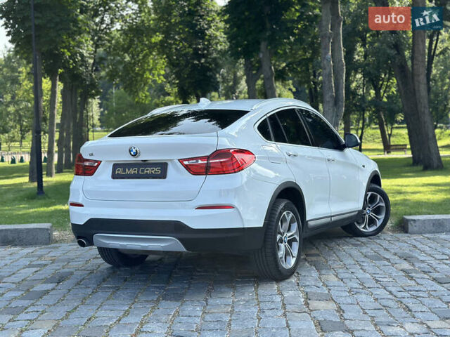 Белый БМВ Х4, объемом двигателя 2 л и пробегом 63 тыс. км за 27700 $, фото 25 на Automoto.ua
