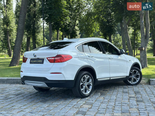 Белый БМВ Х4, объемом двигателя 2 л и пробегом 63 тыс. км за 27700 $, фото 23 на Automoto.ua