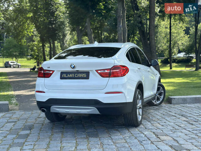 Белый БМВ Х4, объемом двигателя 2 л и пробегом 63 тыс. км за 27700 $, фото 26 на Automoto.ua