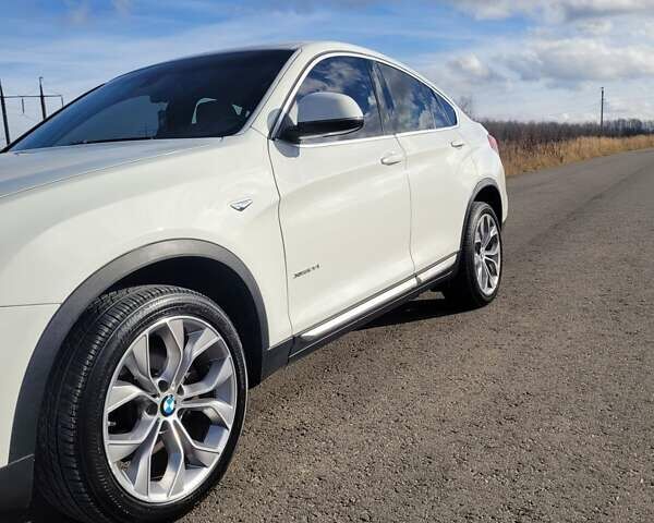 Белый БМВ Х4, объемом двигателя 2 л и пробегом 95 тыс. км за 20900 $, фото 19 на Automoto.ua