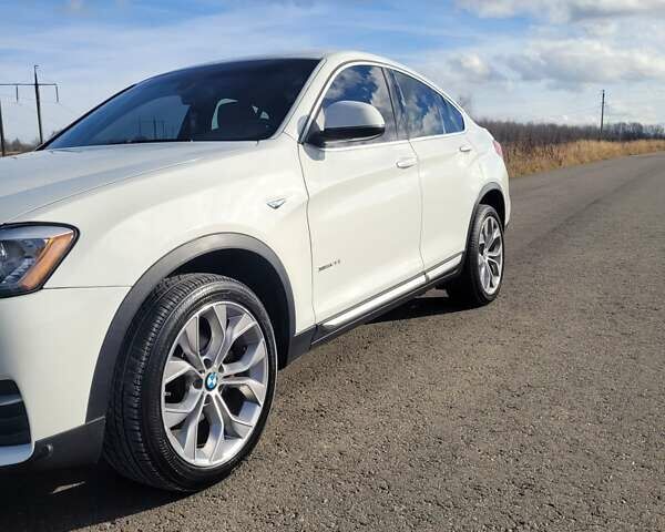 Белый БМВ Х4, объемом двигателя 2 л и пробегом 95 тыс. км за 20900 $, фото 21 на Automoto.ua