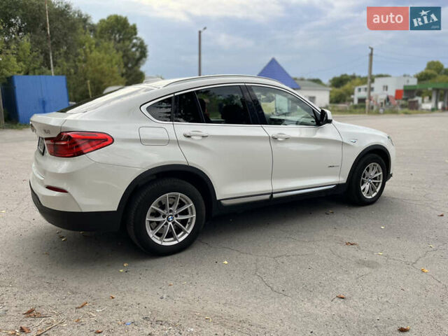 Белый БМВ Х4, объемом двигателя 2 л и пробегом 170 тыс. км за 33800 $, фото 4 на Automoto.ua