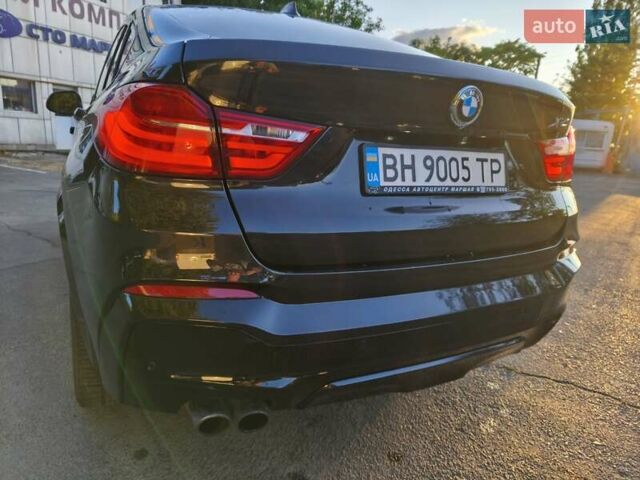 Чорний БМВ Х4, об'ємом двигуна 2 л та пробігом 102 тис. км за 23800 $, фото 1 на Automoto.ua