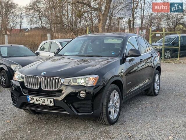 Черный БМВ Х4, объемом двигателя 2 л и пробегом 95 тыс. км за 20850 $, фото 1 на Automoto.ua