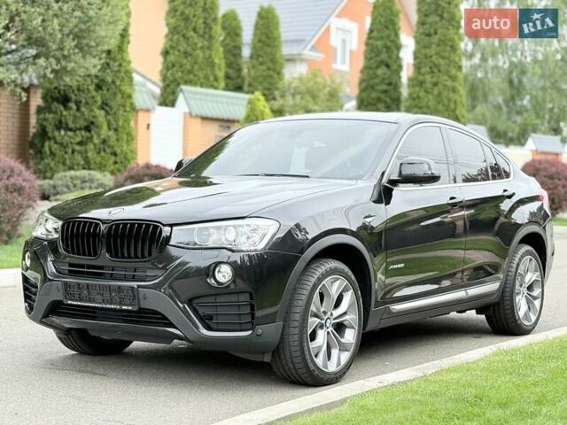 Черный БМВ Х4, объемом двигателя 2 л и пробегом 91 тыс. км за 25700 $, фото 1 на Automoto.ua