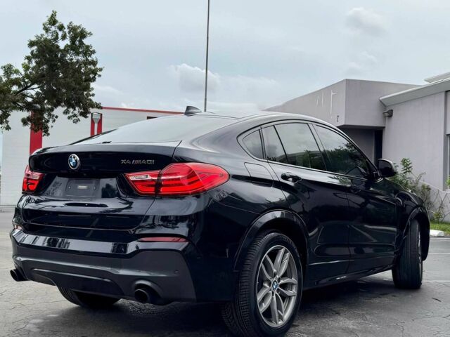 Чорний БМВ Х4, об'ємом двигуна 3 л та пробігом 37 тис. км за 19900 $, фото 4 на Automoto.ua