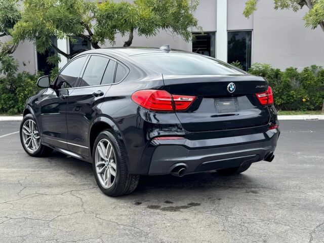 Черный БМВ Х4, объемом двигателя 3 л и пробегом 48 тыс. км за 16700 $, фото 5 на Automoto.ua