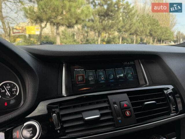 Синій БМВ Х4, об'ємом двигуна 2.98 л та пробігом 130 тис. км за 28300 $, фото 32 на Automoto.ua