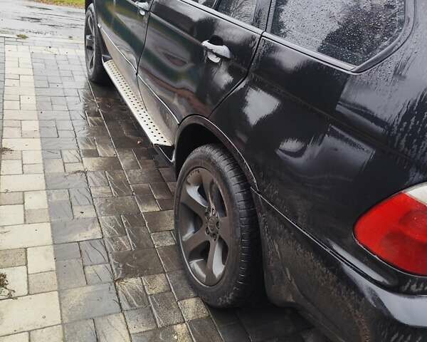 Чорний БМВ Х5, об'ємом двигуна 3 л та пробігом 400 тис. км за 7400 $, фото 3 на Automoto.ua