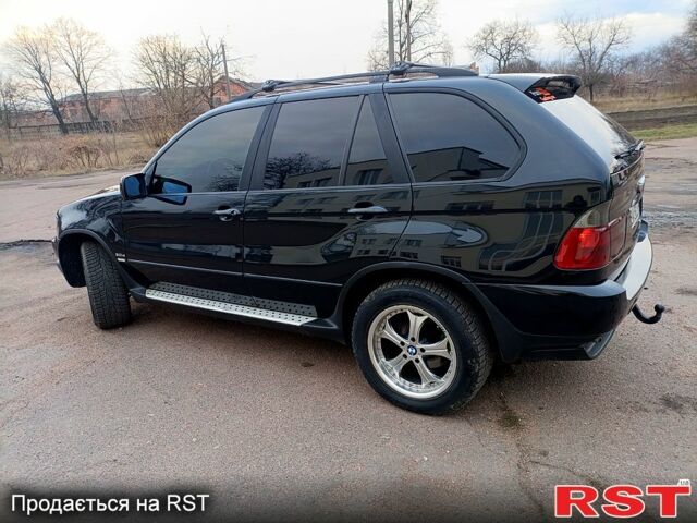 Черный БМВ Х5, объемом двигателя 2.9 л и пробегом 323 тыс. км за 12000 $, фото 4 на Automoto.ua