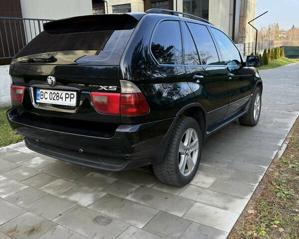 Чорний БМВ Х5, об'ємом двигуна 2.93 л та пробігом 391 тис. км за 7950 $, фото 4 на Automoto.ua