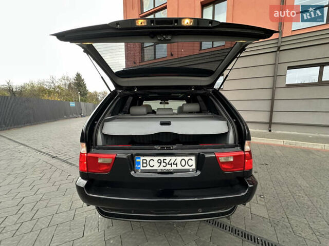 Чорний БМВ Х5, об'ємом двигуна 3 л та пробігом 304 тис. км за 10350 $, фото 91 на Automoto.ua