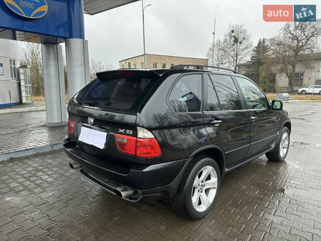 Чорний БМВ Х5, об'ємом двигуна 3 л та пробігом 320 тис. км за 5999 $, фото 5 на Automoto.ua