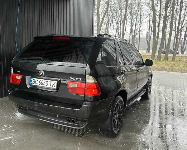 Черный БМВ Х5, объемом двигателя 4.4 л и пробегом 430 тыс. км за 9500 $, фото 1 на Automoto.ua