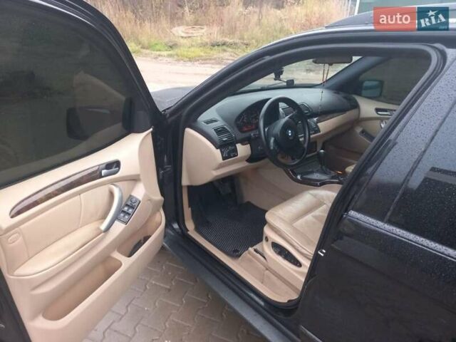 Черный БМВ Х5, объемом двигателя 3 л и пробегом 331 тыс. км за 12500 $, фото 11 на Automoto.ua
