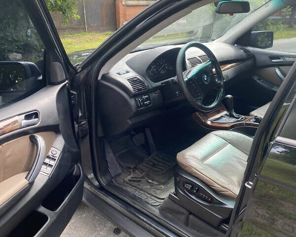 Черный БМВ Х5, объемом двигателя 3 л и пробегом 318 тыс. км за 11900 $, фото 12 на Automoto.ua