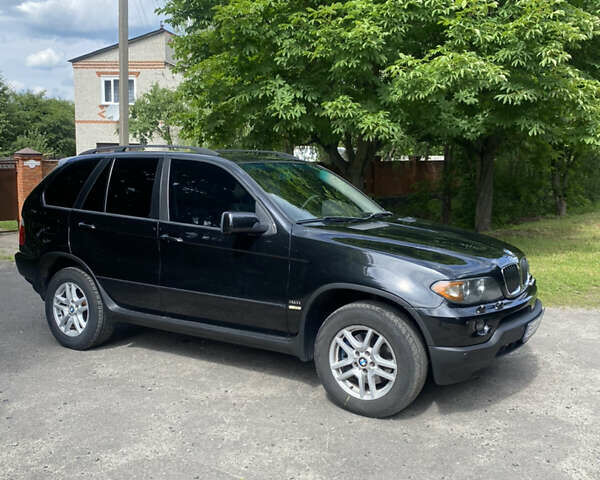 Черный БМВ Х5, объемом двигателя 3 л и пробегом 318 тыс. км за 11900 $, фото 1 на Automoto.ua