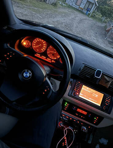 Чорний БМВ Х5, об'ємом двигуна 4.4 л та пробігом 165 тис. км за 12000 $, фото 4 на Automoto.ua