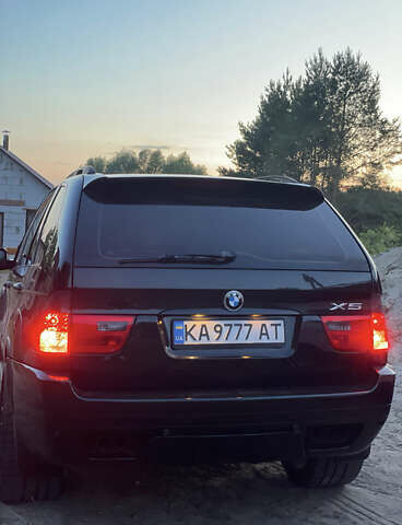 Чорний БМВ Х5, об'ємом двигуна 4.4 л та пробігом 165 тис. км за 12000 $, фото 1 на Automoto.ua