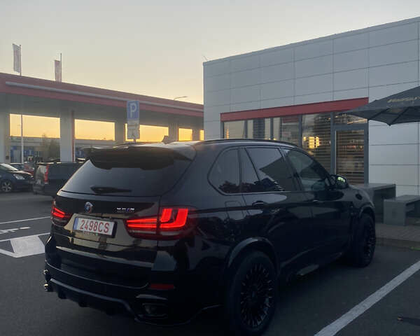 Черный БМВ Х5, объемом двигателя 2 л и пробегом 330 тыс. км за 31500 $, фото 1 на Automoto.ua