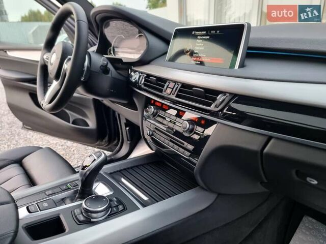 Черный БМВ Х5, объемом двигателя 3 л и пробегом 258 тыс. км за 34700 $, фото 81 на Automoto.ua