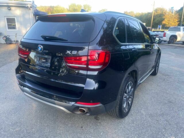 Чорний БМВ Х5, об'ємом двигуна 3 л та пробігом 90 тис. км за 16700 $, фото 2 на Automoto.ua