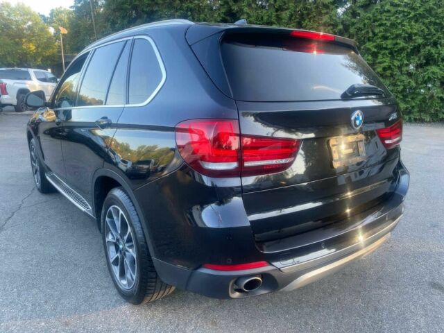 Чорний БМВ Х5, об'ємом двигуна 3 л та пробігом 90 тис. км за 16700 $, фото 4 на Automoto.ua