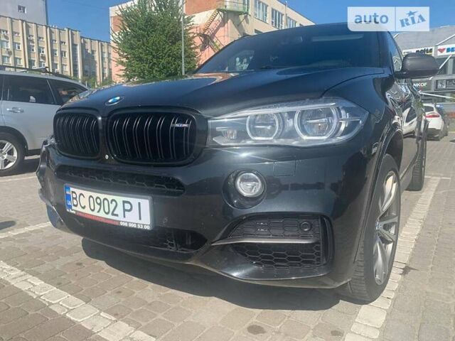 Чорний БМВ Х5, об'ємом двигуна 3 л та пробігом 233 тис. км за 31500 $, фото 2 на Automoto.ua